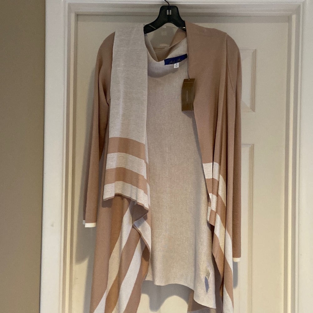 Tan and Creme light sweater poncho with arm sleeves.